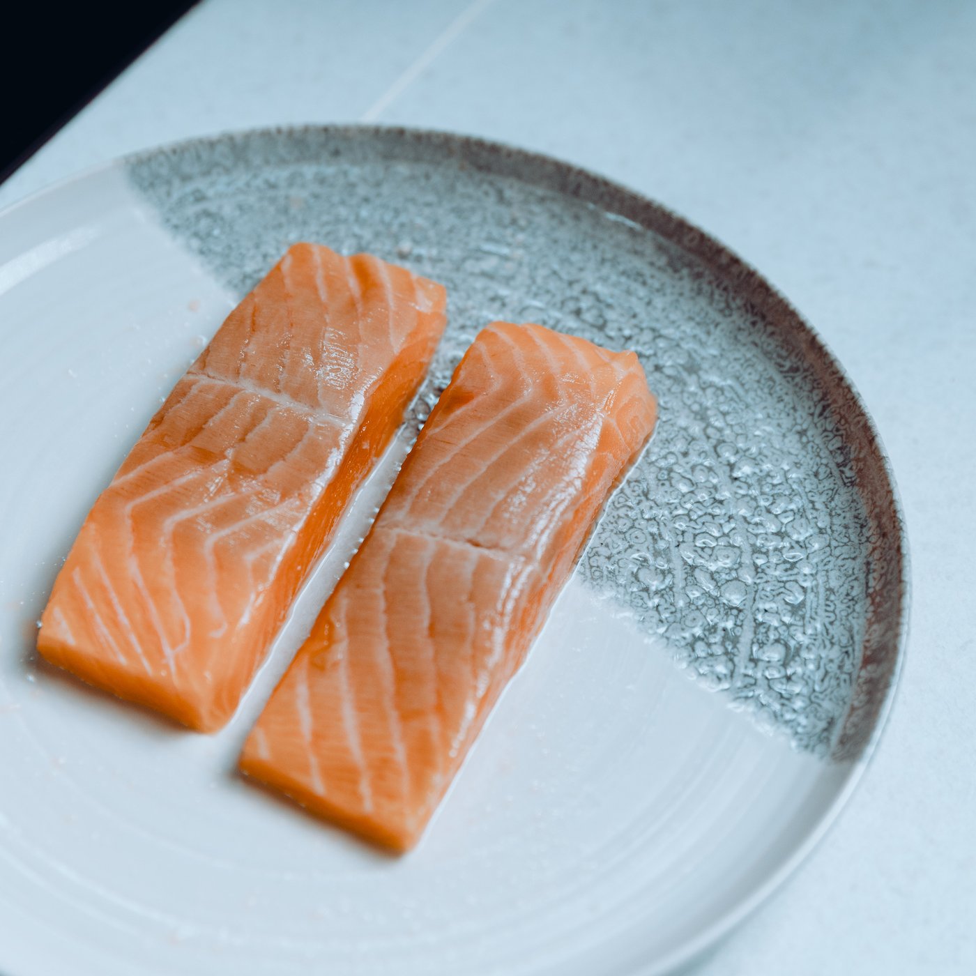 Chef Carlos Afonso cooking salmon with bulgur
