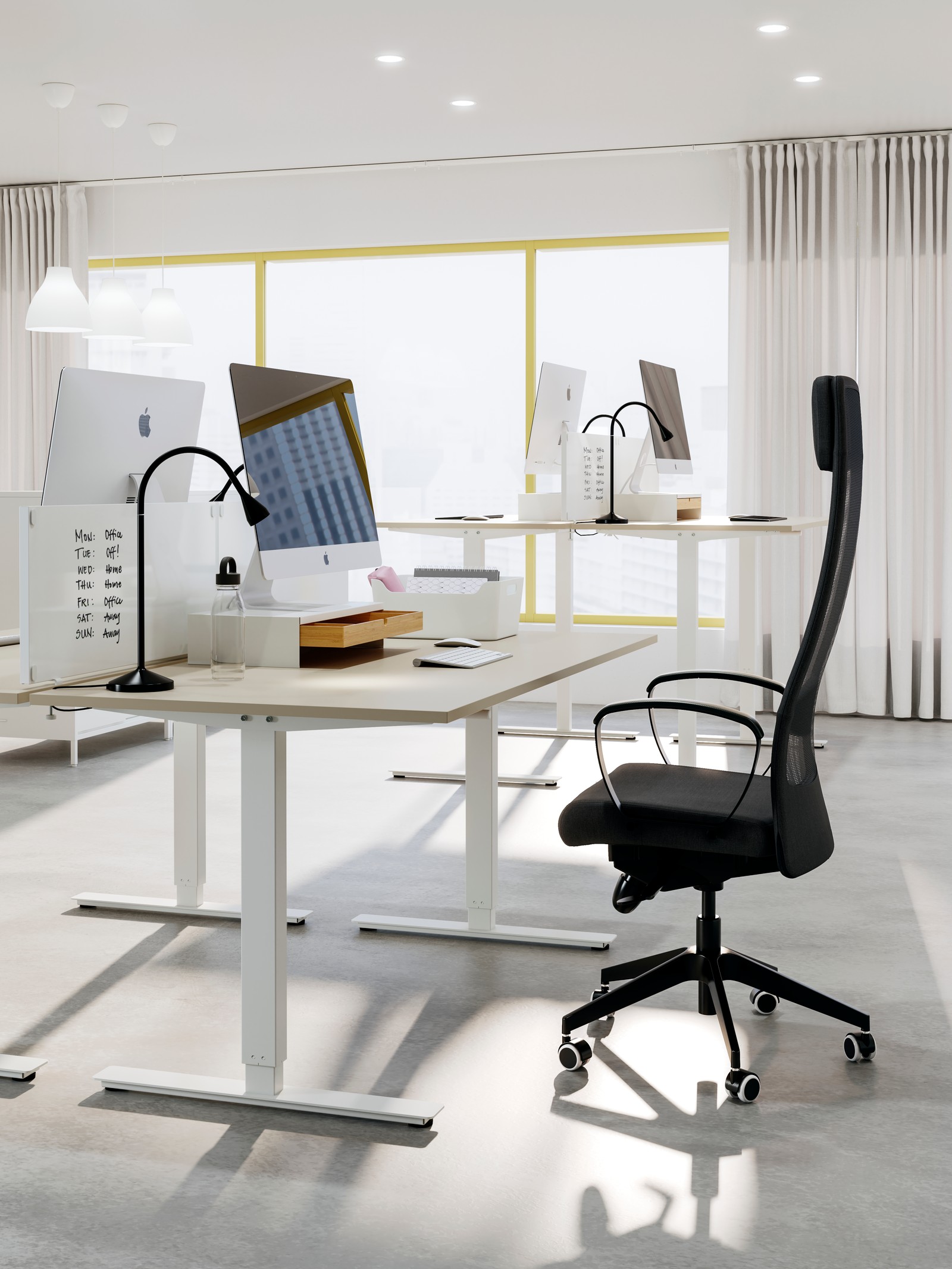 A white ELLOVEN monitor stand with drawer