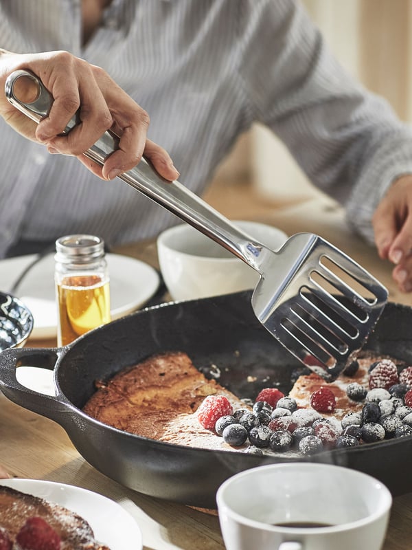 A stainless steel FINMAT spatula