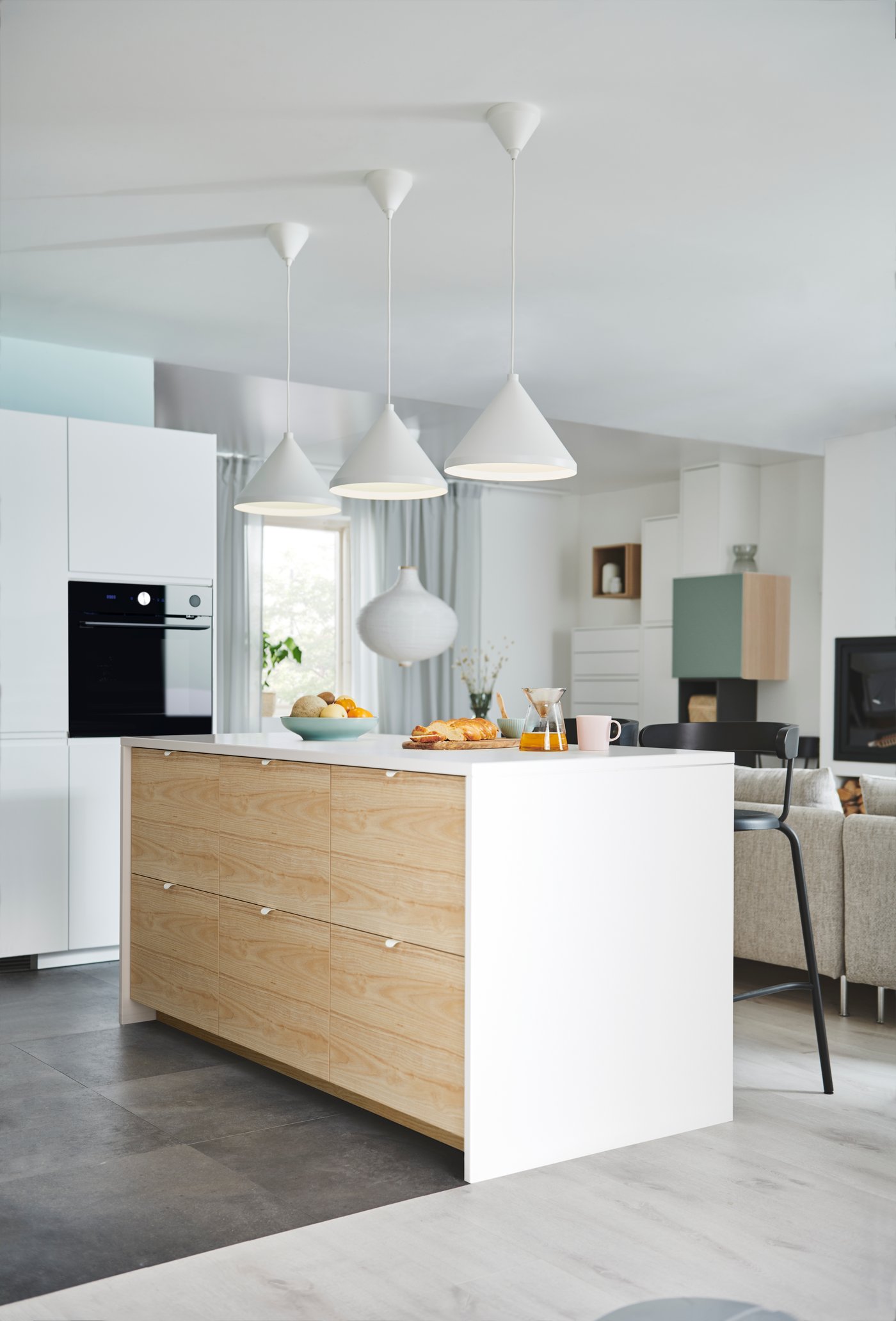 An onion shape/white RISBYN pendant lampshade in the kitchen