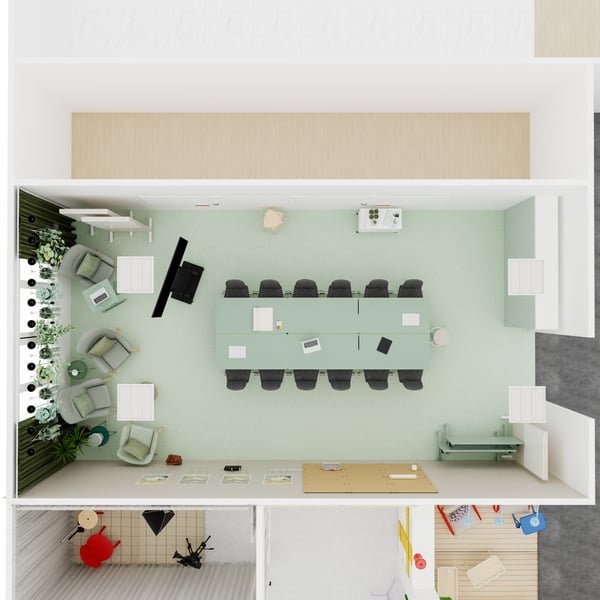 Grundriss eines großen Konferenzraums mit Tischreihe Bestuhlung, weiteren Sitzmöbeln und Arbeitsmaterialien.
