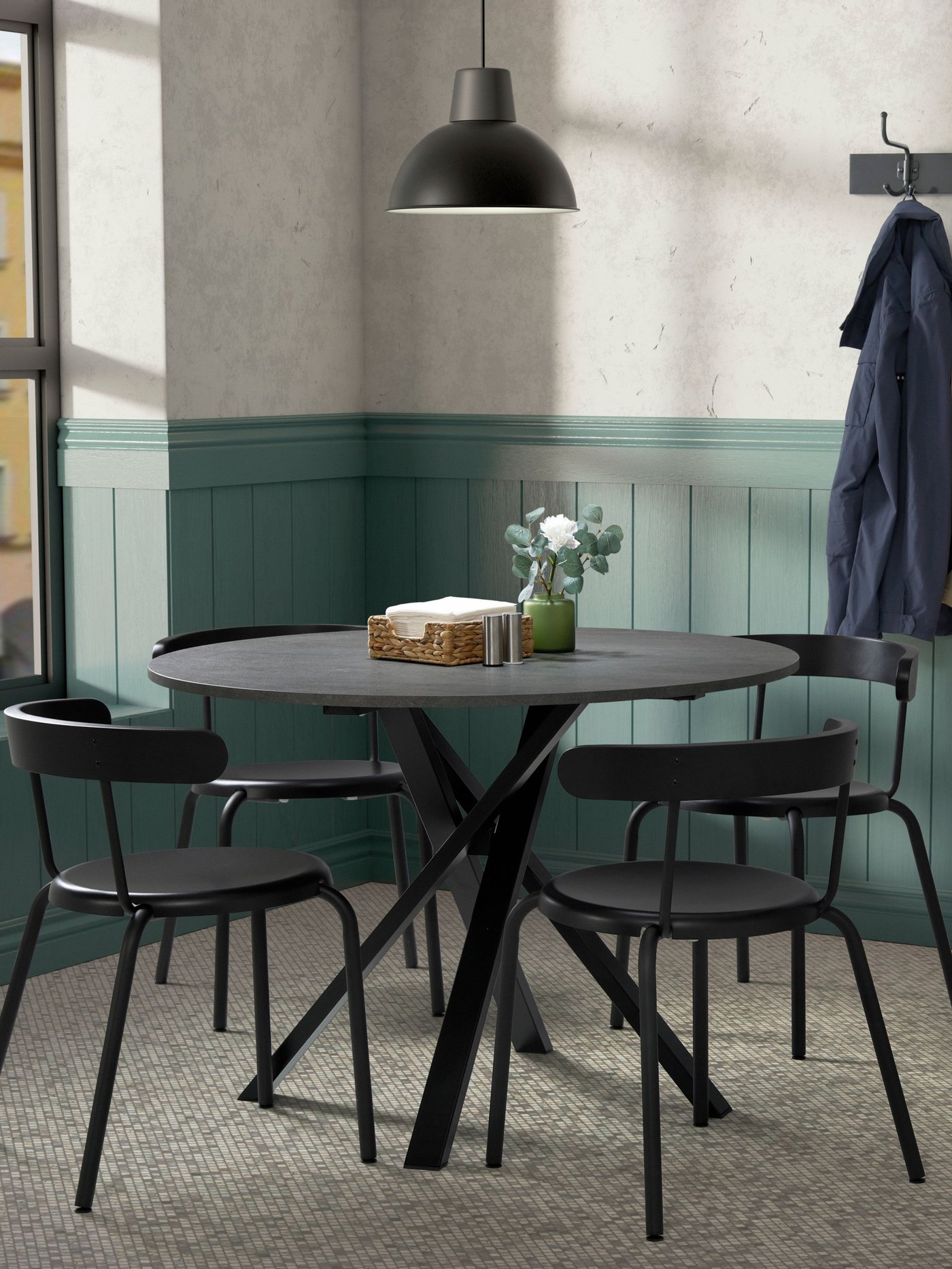 A dark grey round MARIEDAMM dining table