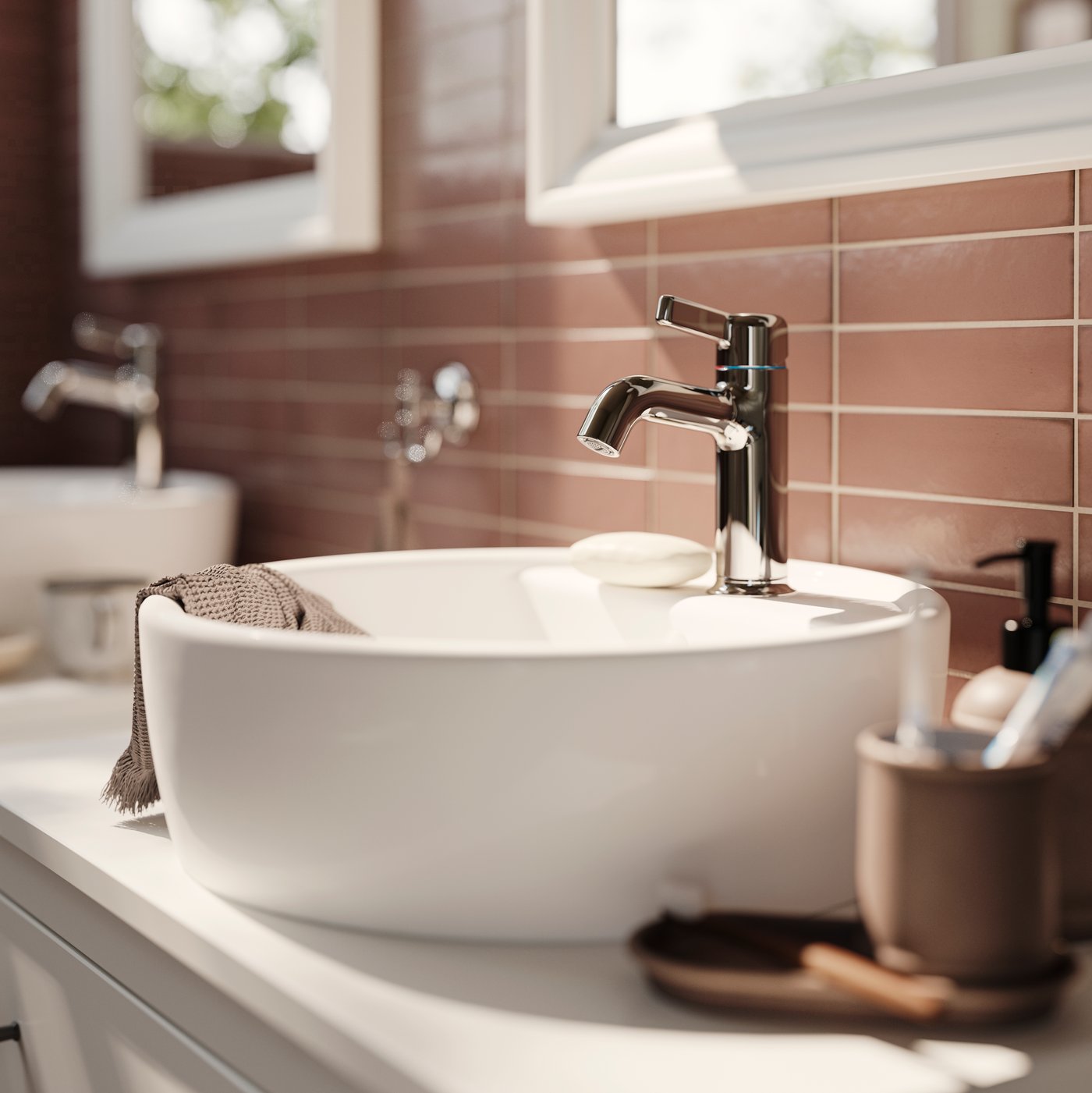 TÖRNVIKEN countertop wash basins in white with VOXNAN wash basin mixer taps, chrome plated and TOFTBYN mirrors in white.