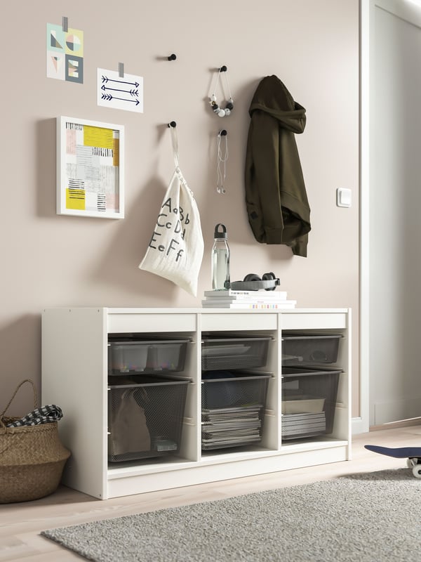 A white/dark grey TROFAST storage combination with boxes