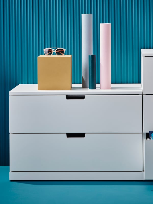 A white NORDLI chest of 5 drawers in the home office