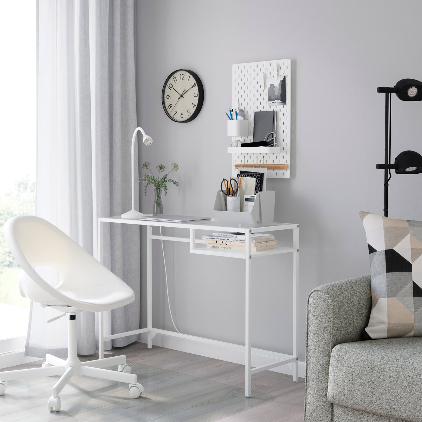 The stylish and slim VITTSJÖ laptop table in metal and tempered glass has clean lines and is an easy-to-place piece of furniture. With the open and airy design, you enjoy a good and discreet work surface.

