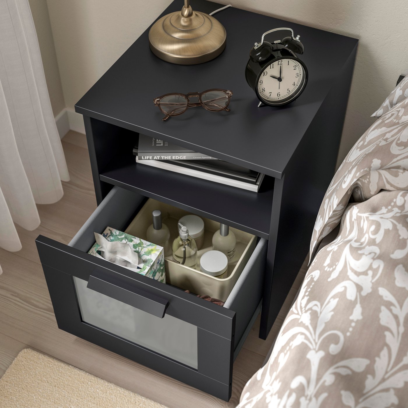 A black BRIMNES bedside table