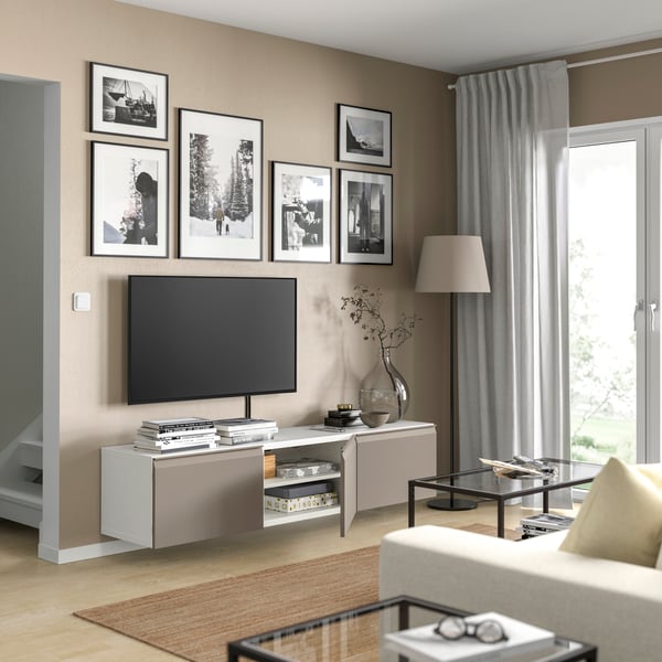 A white/Hammarsmed beige BESTÅ TV bench with doors