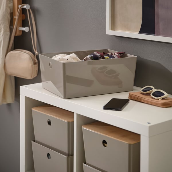 A dark grey-beige KUGGIS box