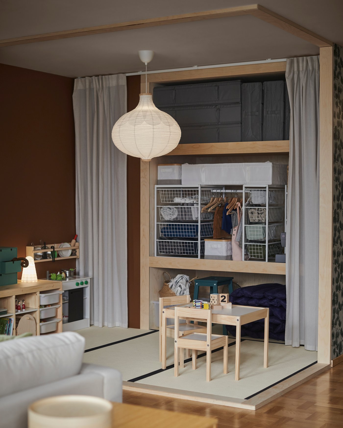 A dark grey SKUBB storage case in the living room