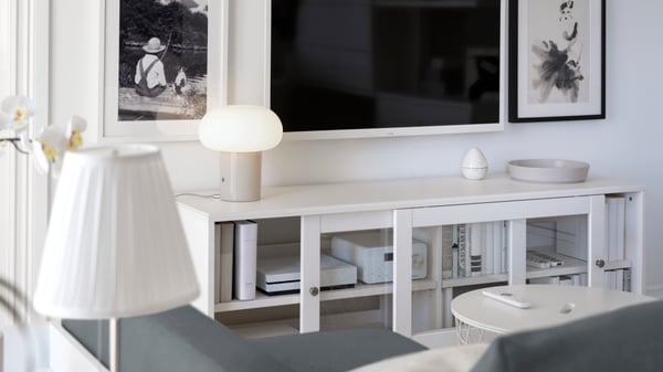 A beige/opal white glass DEJSA table lamp