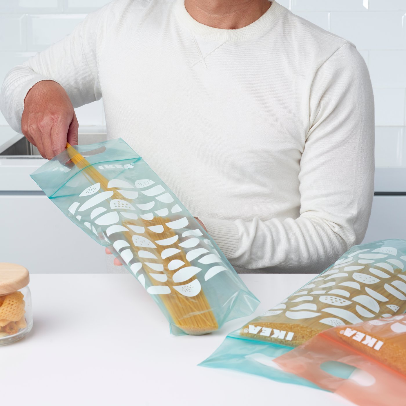 A light orange-pink/blue BEKOSTA resealable bag