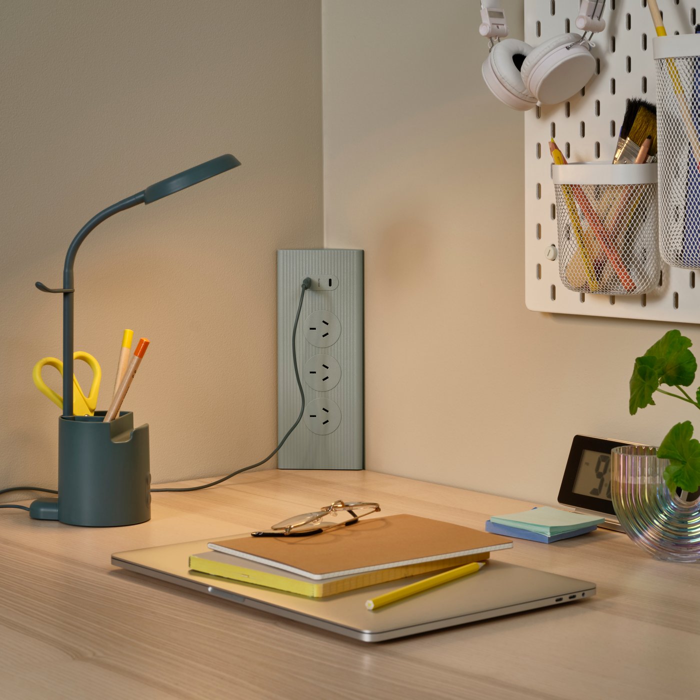 A green SKOTAT extension cord