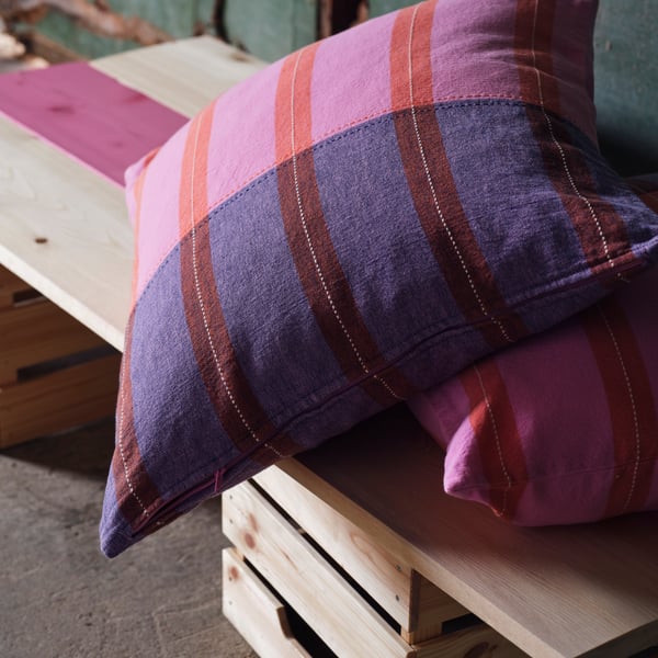 A pink/orange MÄVINN cushion cover