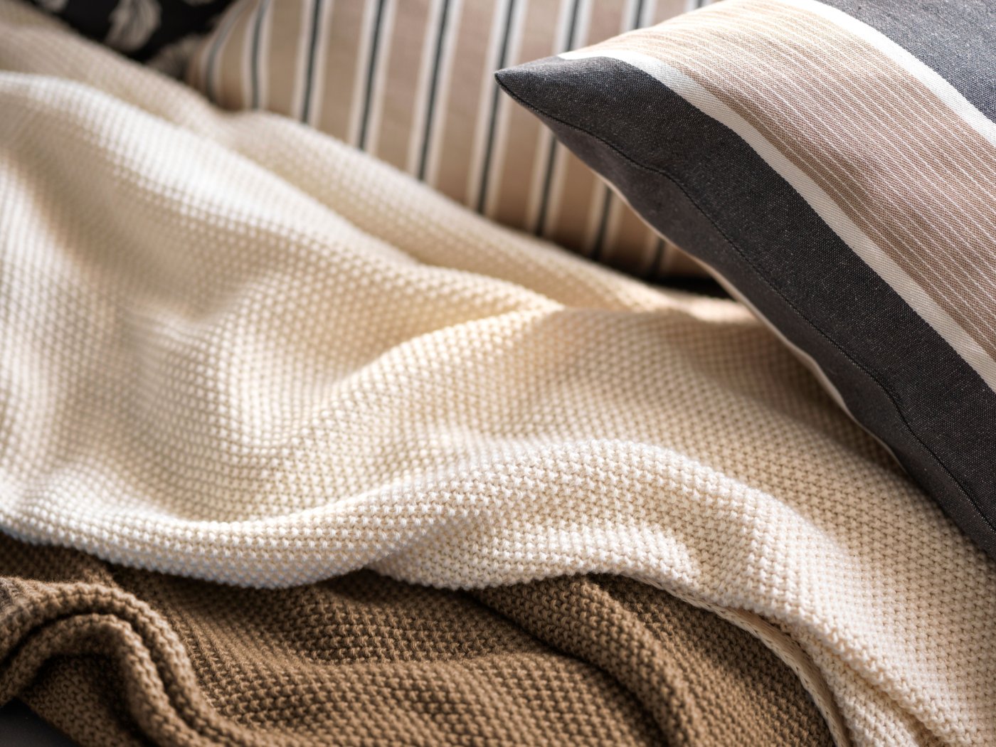 An off-white HUMLEMOTT throw