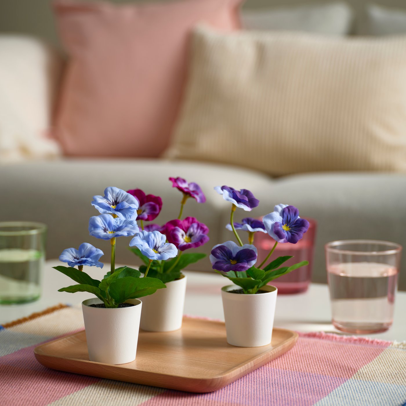 FEJKA artificial potted plants, pansy, indoor and outdoor on a coffee table in the living room. 