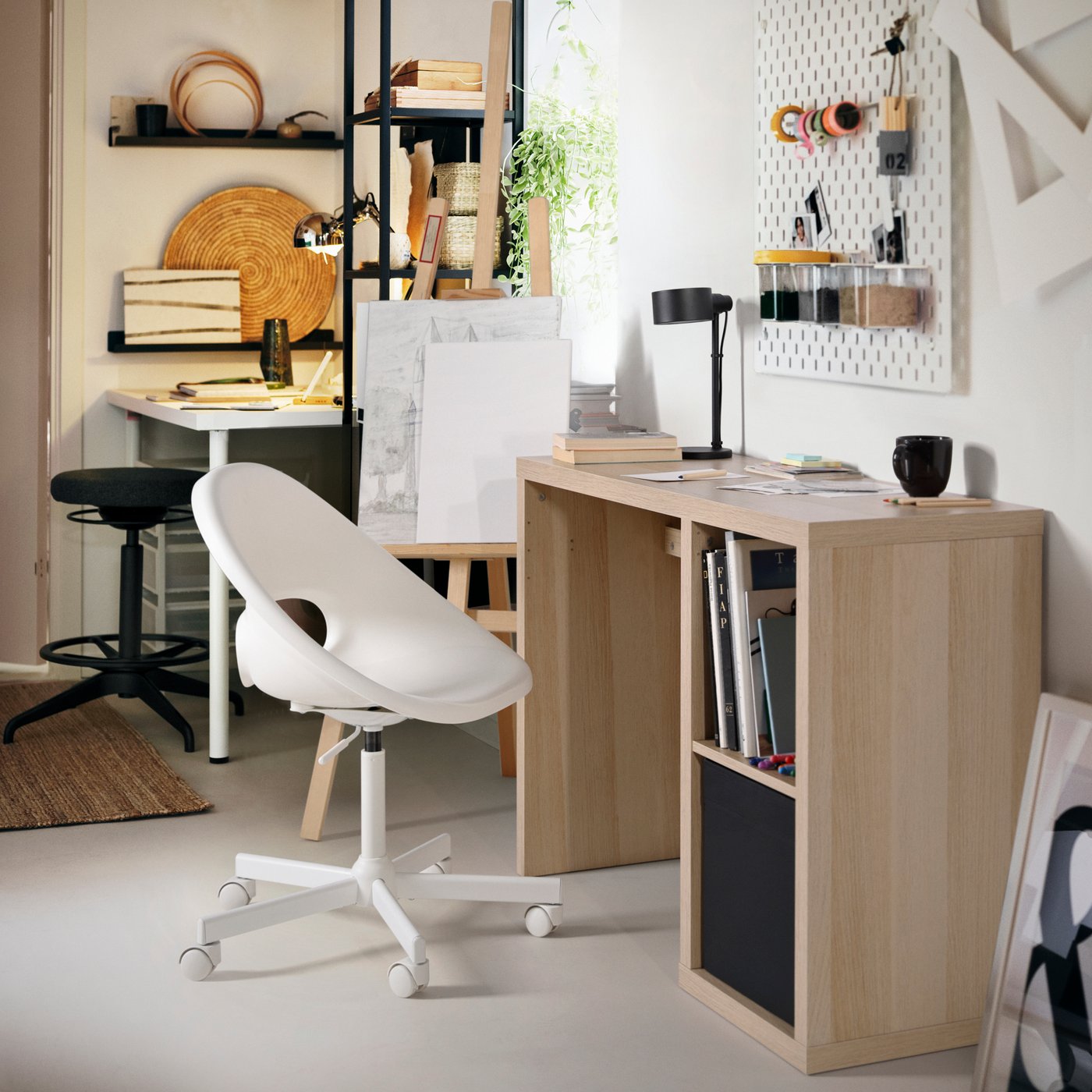A white SKÅDIS pegboard in the home office