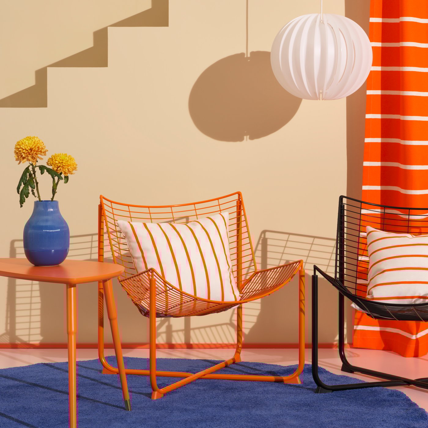 An orange SKÅLBODA armchair