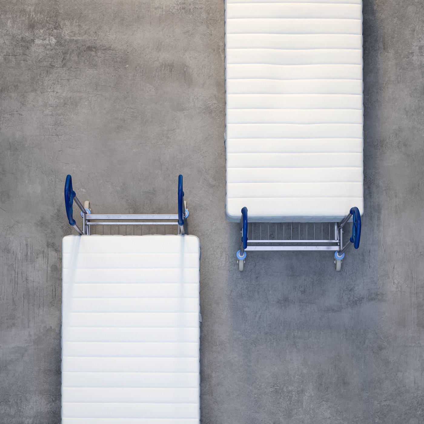Two mattresses laid out on two separate carts