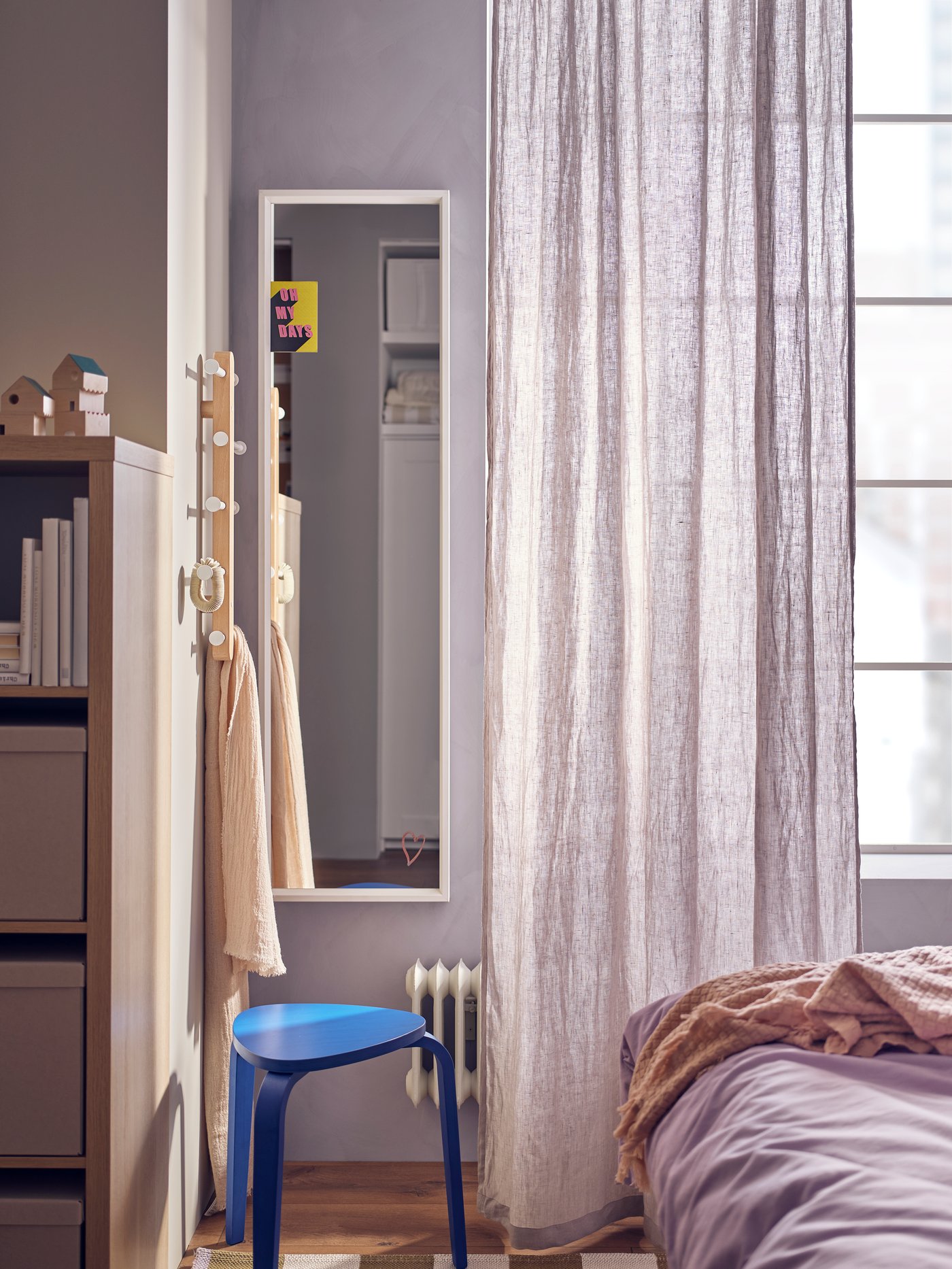 A PLOGA vertical hook rack with NISSEDAL mirror