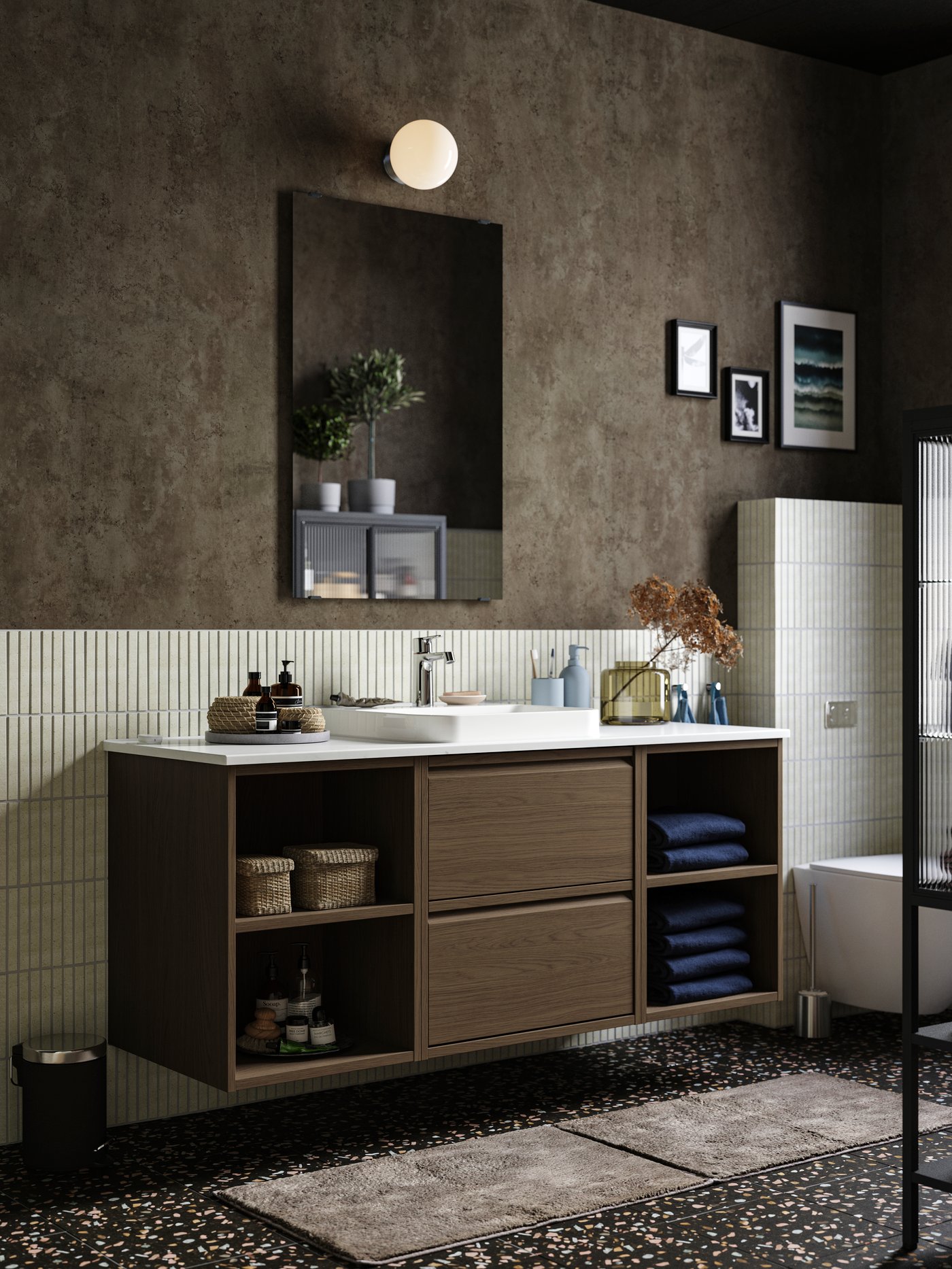 A chrome-plated SKOGHALL hook, self-adhesive in the bathroom