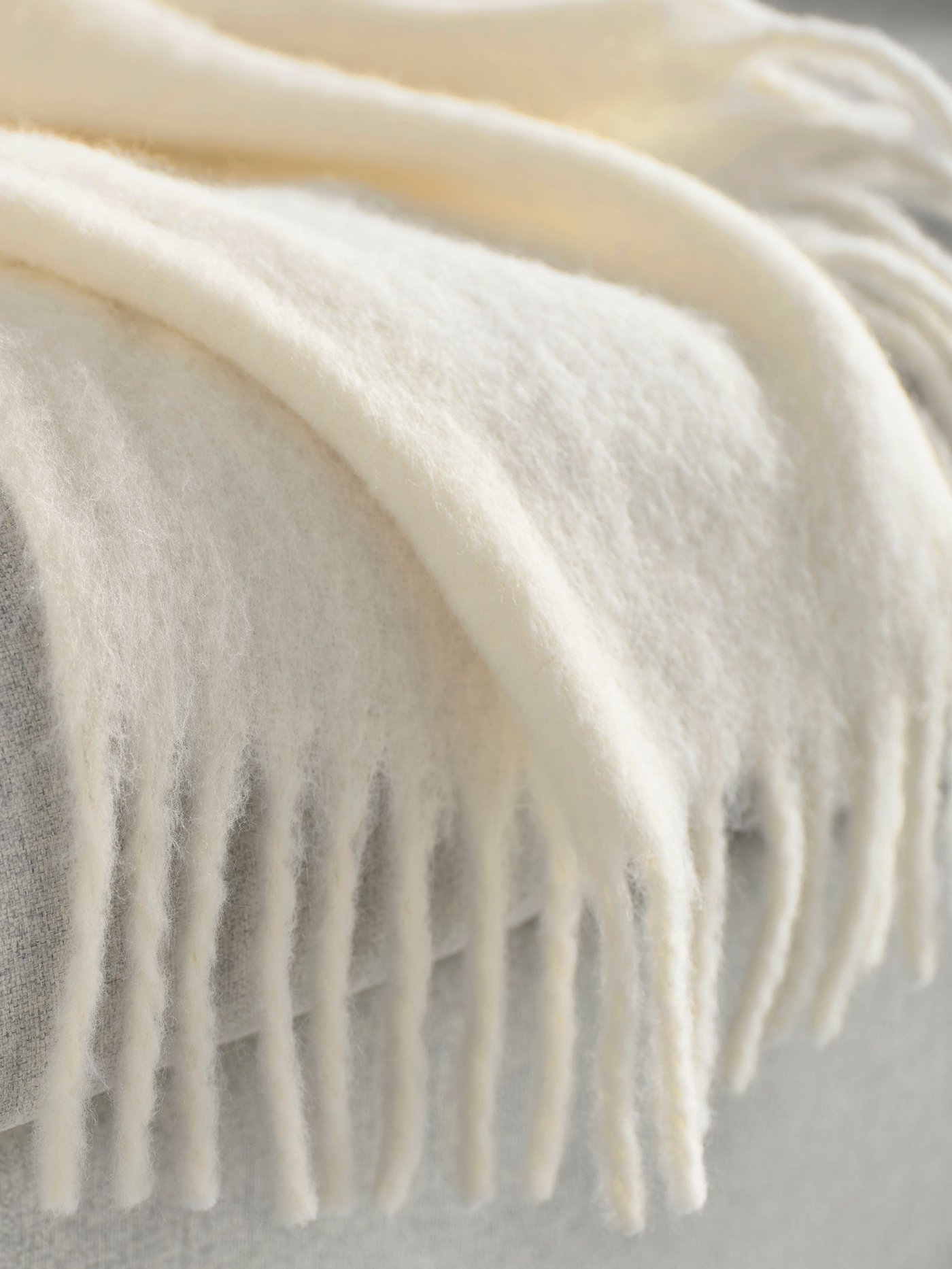 An off-white KLIPPOXEL throw