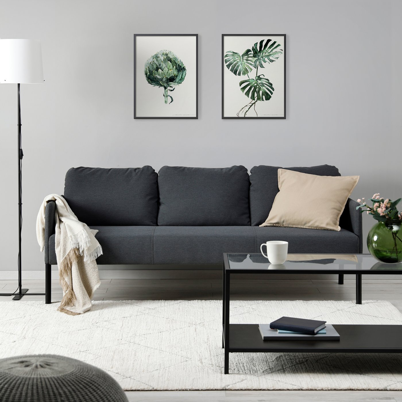 A Knisa dark grey GLOSTAD 3-seat sofa in the living room