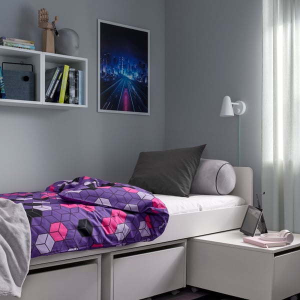 A purple/black patterned BLÅSKATA duvet cover and pillowcase