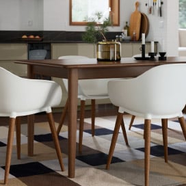 A white GRÖNSTA chair with armrests, in/outdoor