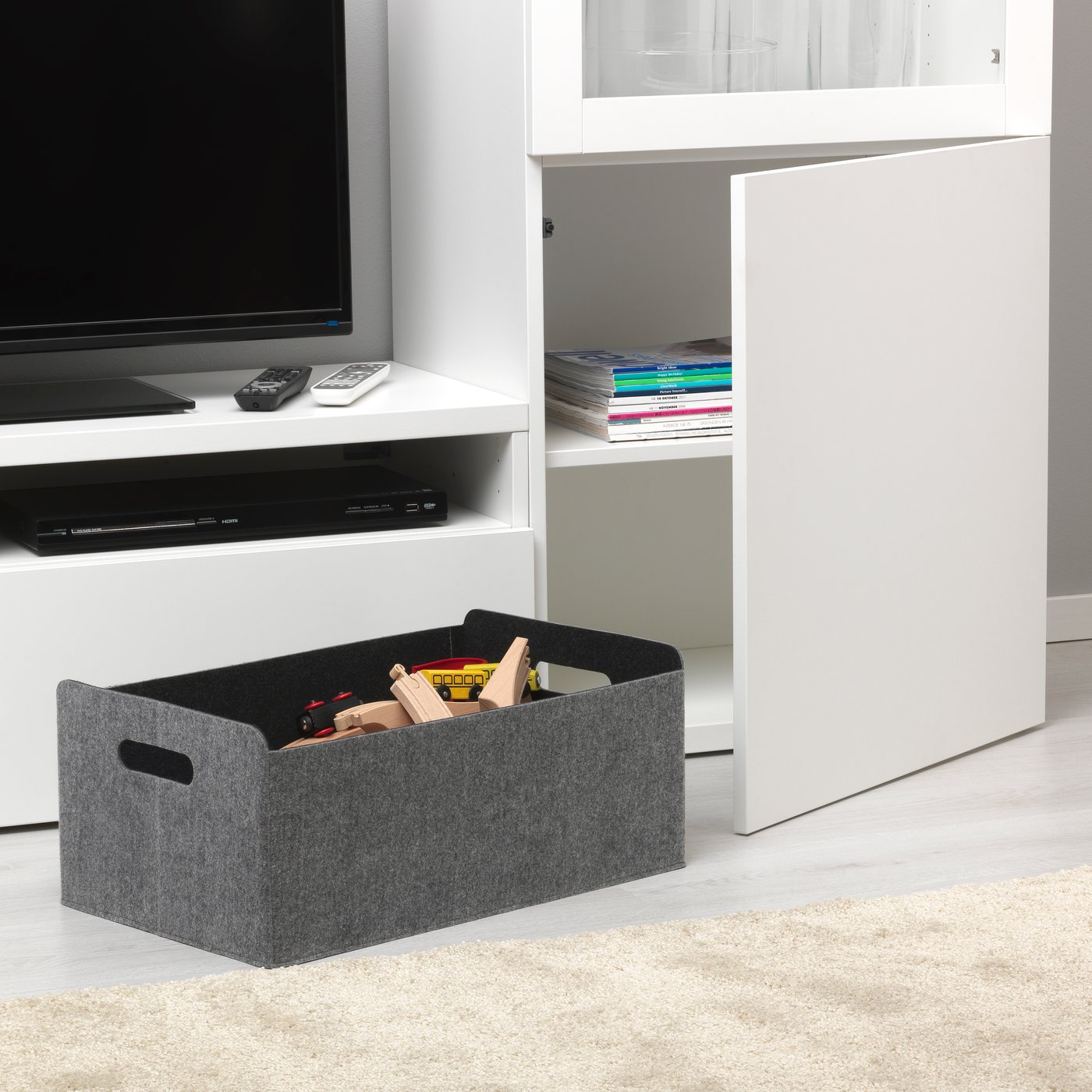 A grey BESTÅ box in the living room