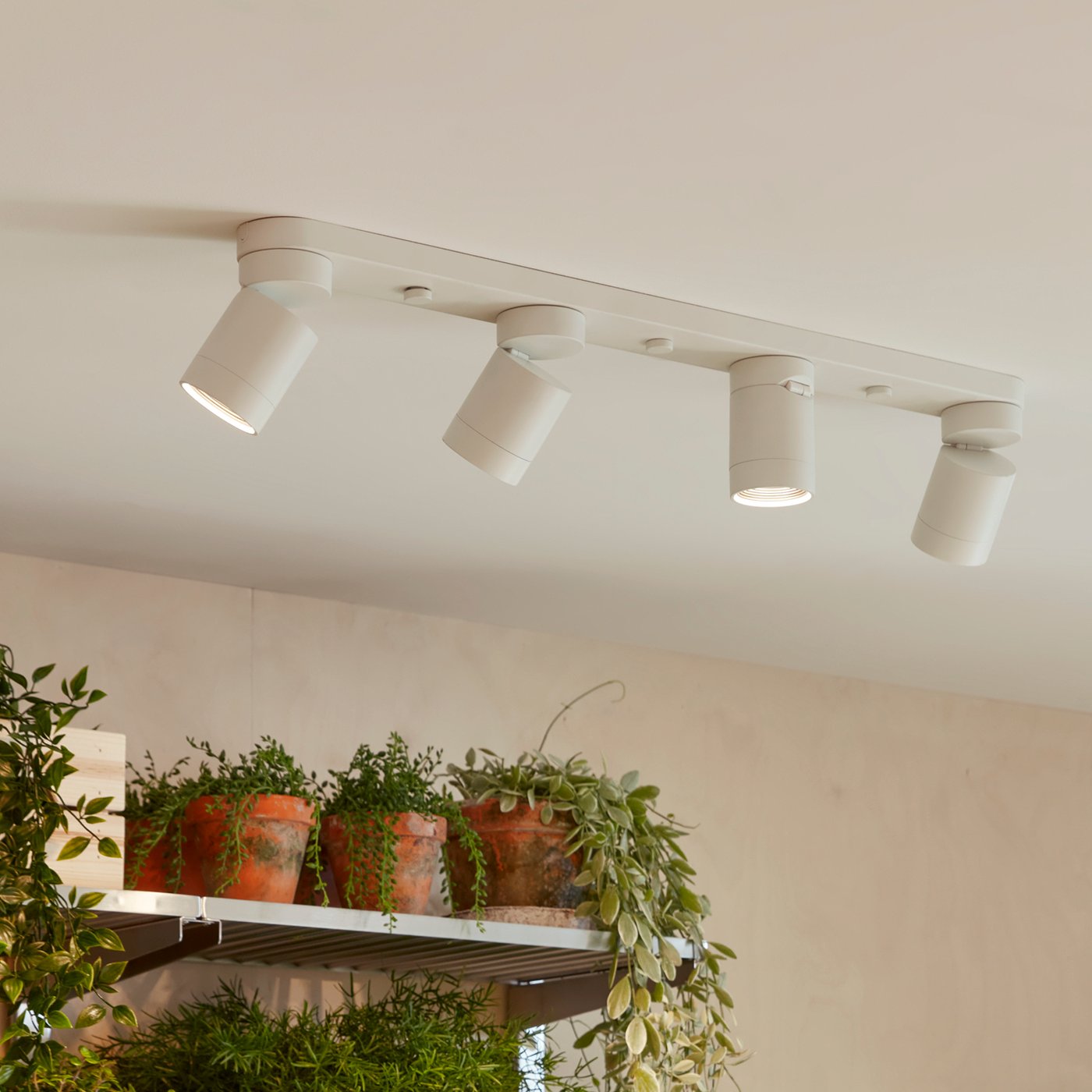 A white NYMÅNE ceiling spotlight with 4 spots