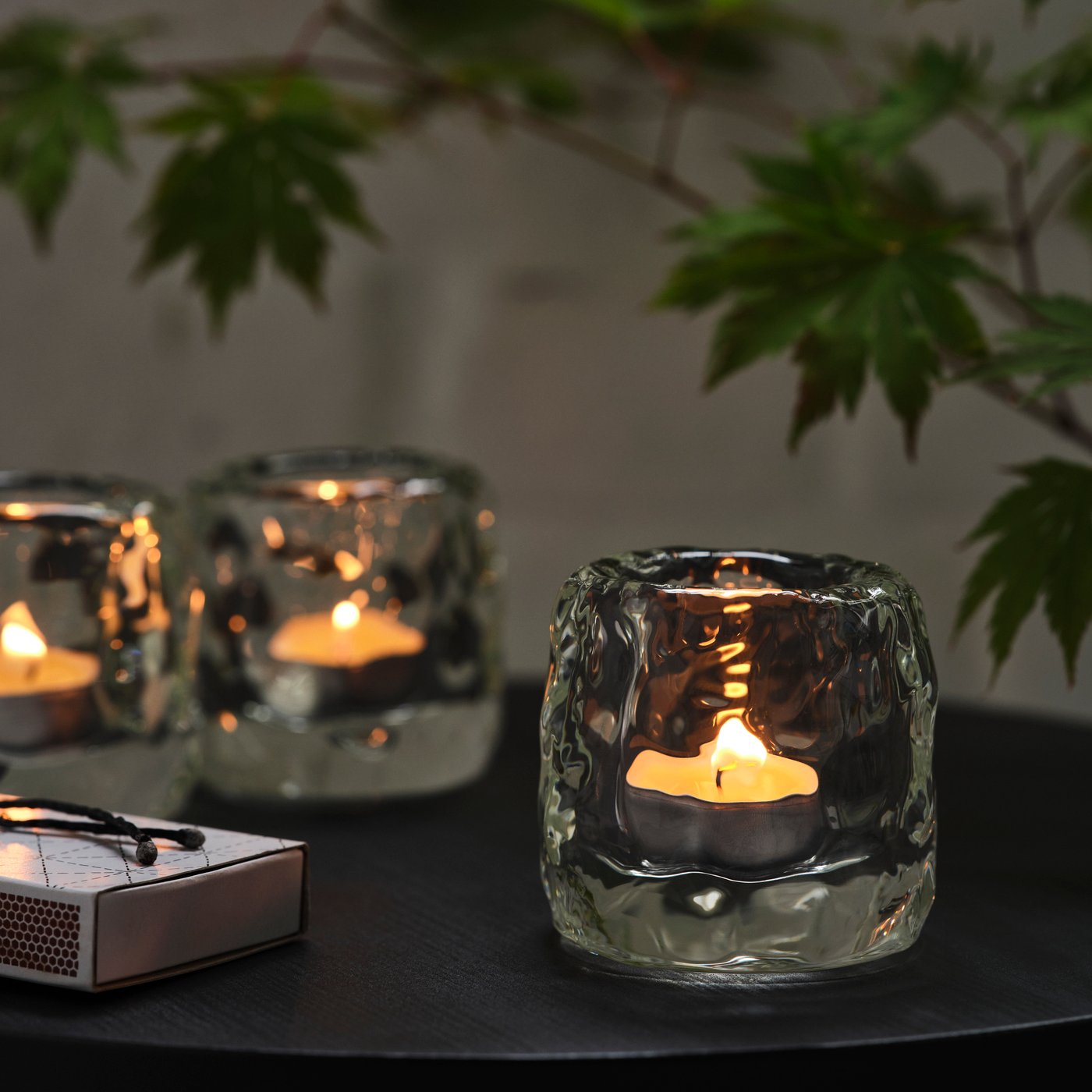 A white JUBLA unscented tealight