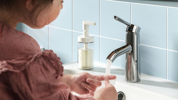 A chrome-plated DALSKÄR wash-basin mixer tap in the bathroom