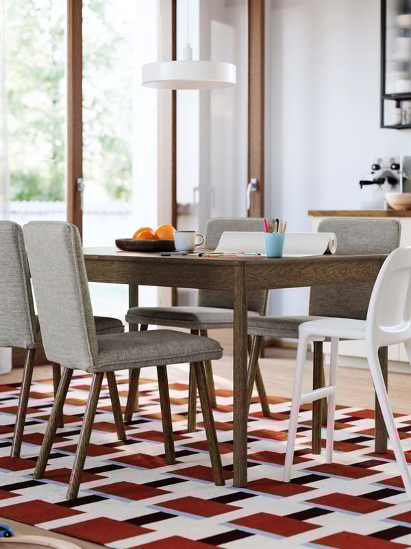 A brown stained oak veneer TONSTAD extendable table