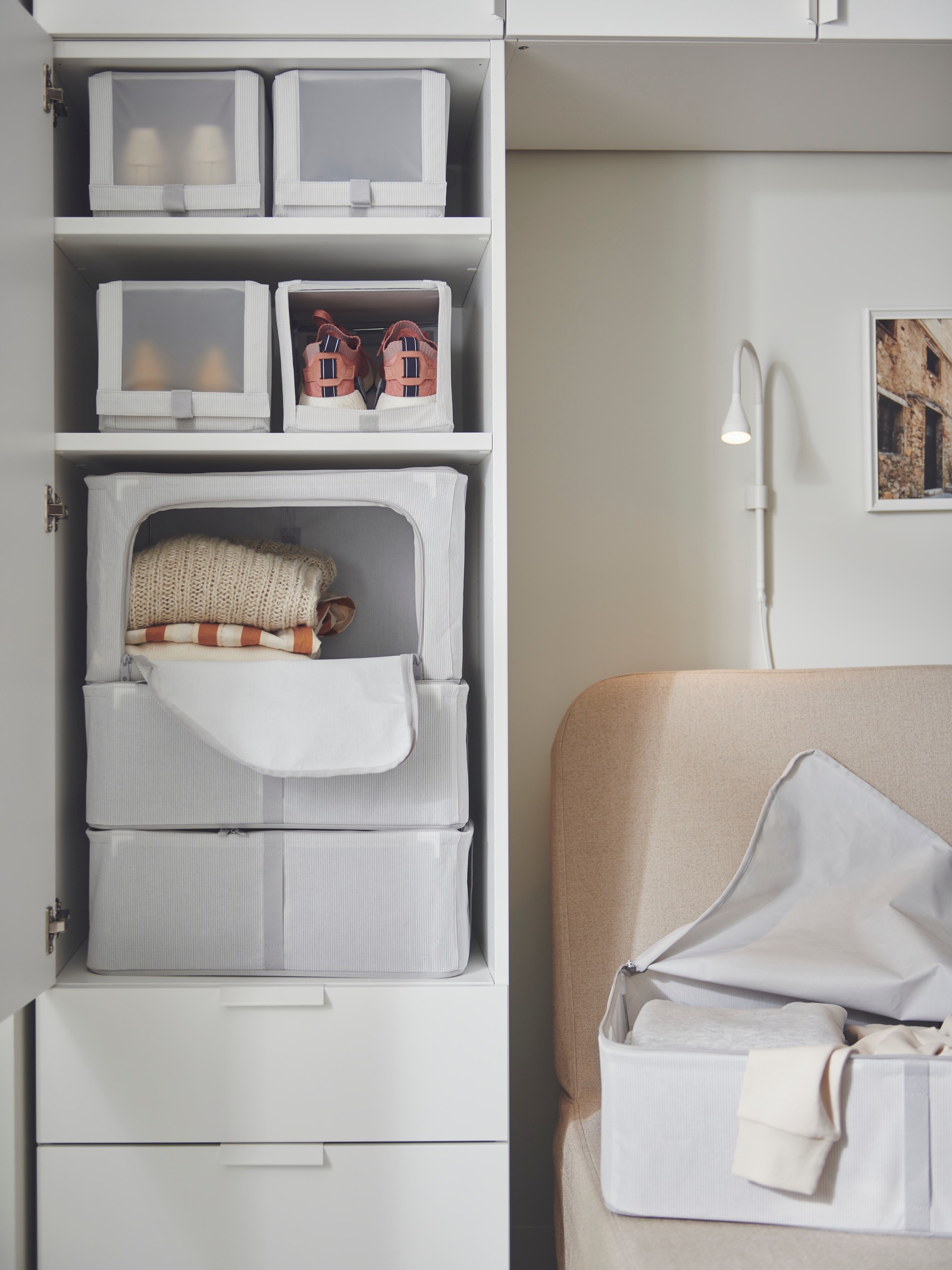 A white NÄVLINGE LED wall/clamp spotlight