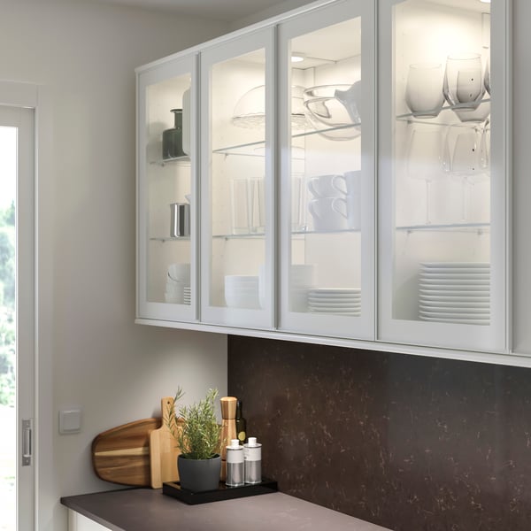 A white/clear glass HEJSTA glass door