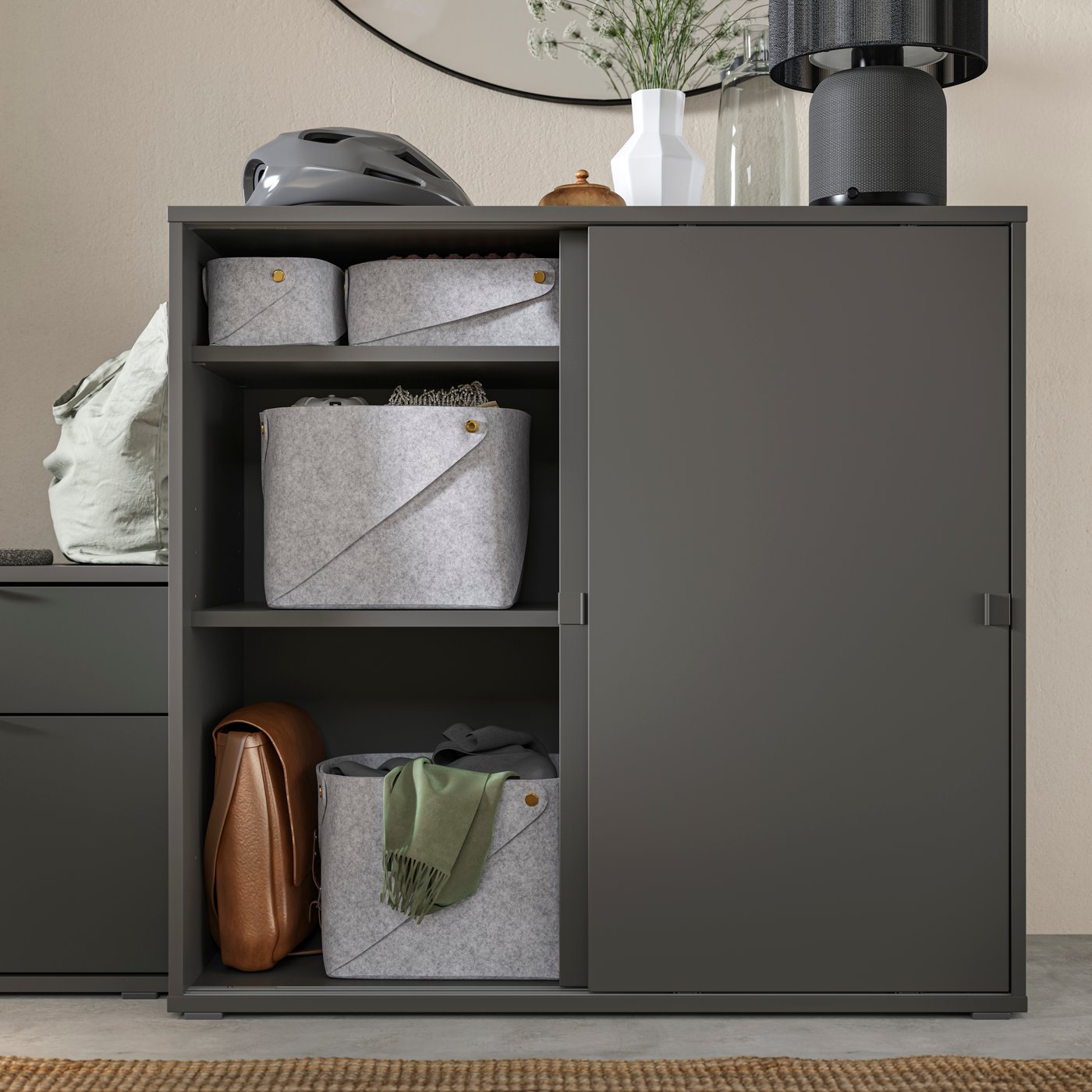 A dark grey VIHALS cabinet with sliding doors