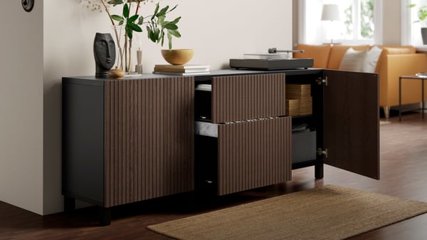 A black-brown Björköviken/Stubbarp/brown stained oak veneer BESTÅ storage combination with drawers in the hallway