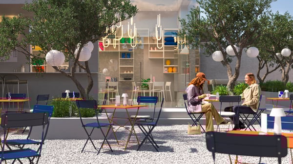 A café with an indoor and a sunny outdoor space with trees, different lamps and customers sitting at the SUNDSÖ bistro sets.