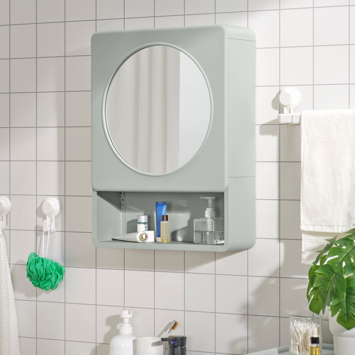 A green IVÖSJÖN mirror cabinet with 1 door