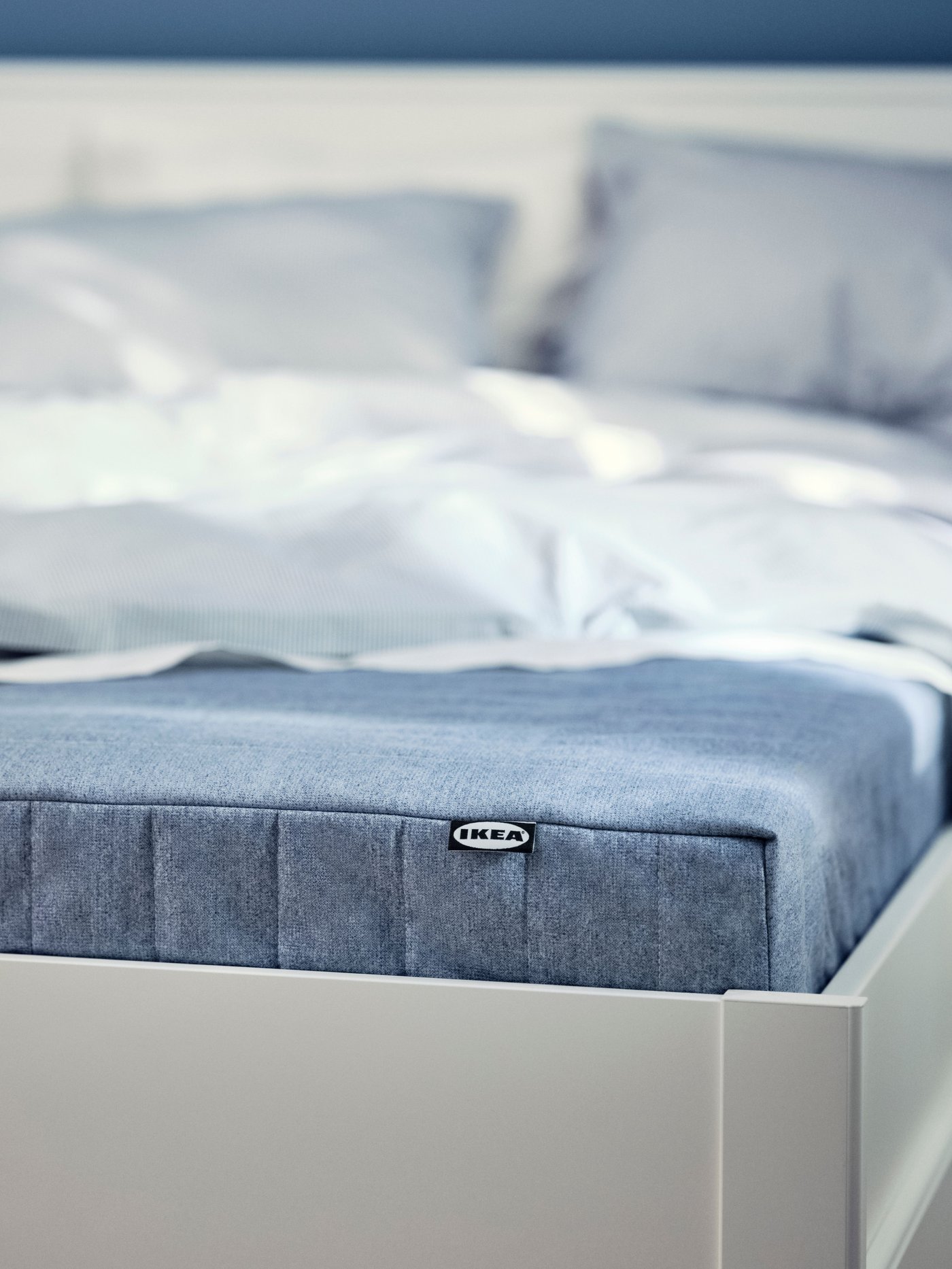 An extra firm/light blue VADSÖ sprung mattress