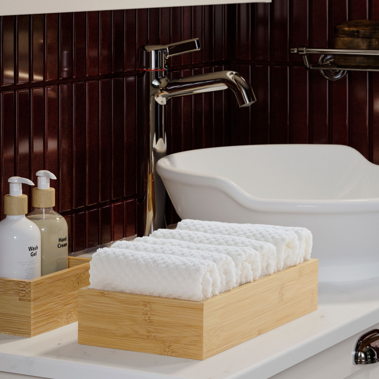 A bathroom sink with GULVIAL white washcloths neatly folded in a bamboo tray beside liquid soap and hand lotion bottles.