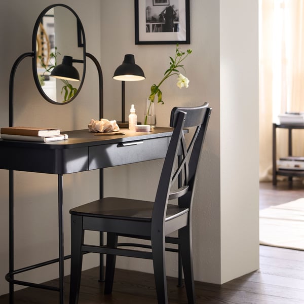 A dark brown beech veneer LISTERBY side table in the bedroom
