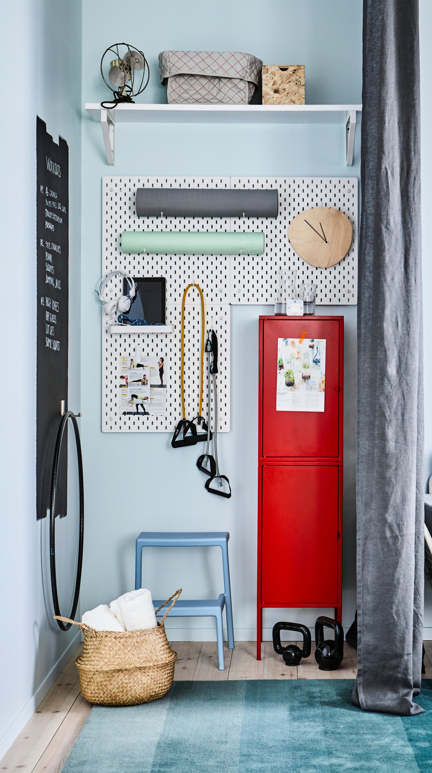 A white SKÅDIS pegboard in the hallway
