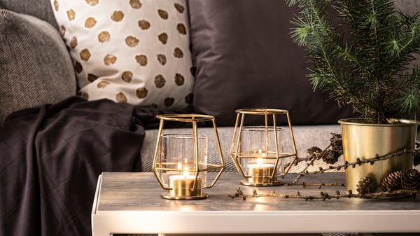 PÄRLBAND Tealight holders are standing on a table in a living room