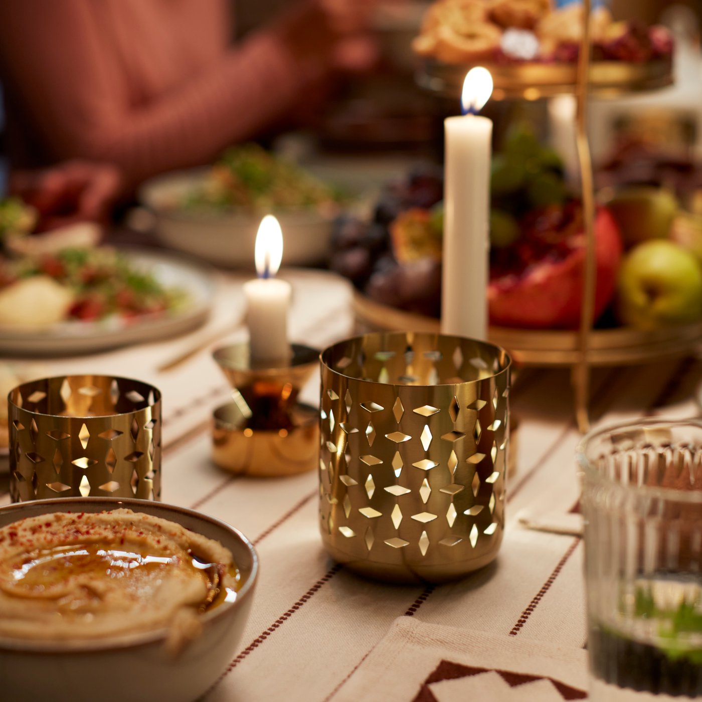 A white JUBLA unscented chandelier candle