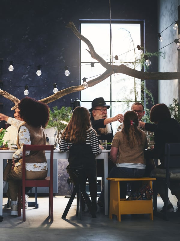 A pine PERJOHAN stool with storage in the dining room