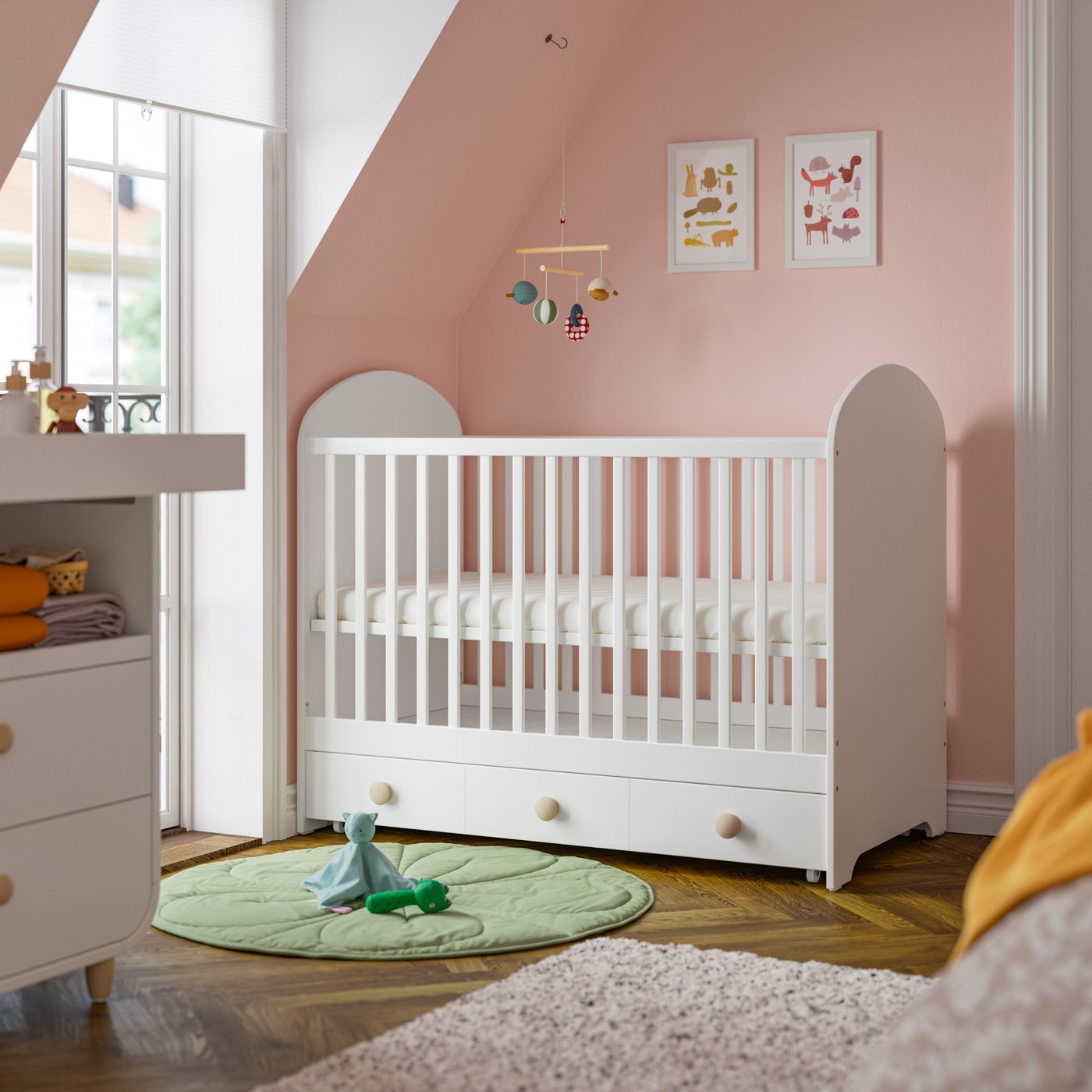 GONATT cot with drawer 136 cm white in a children's room.