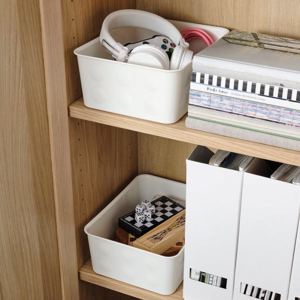 Een plastic/witte NOJIG opberger