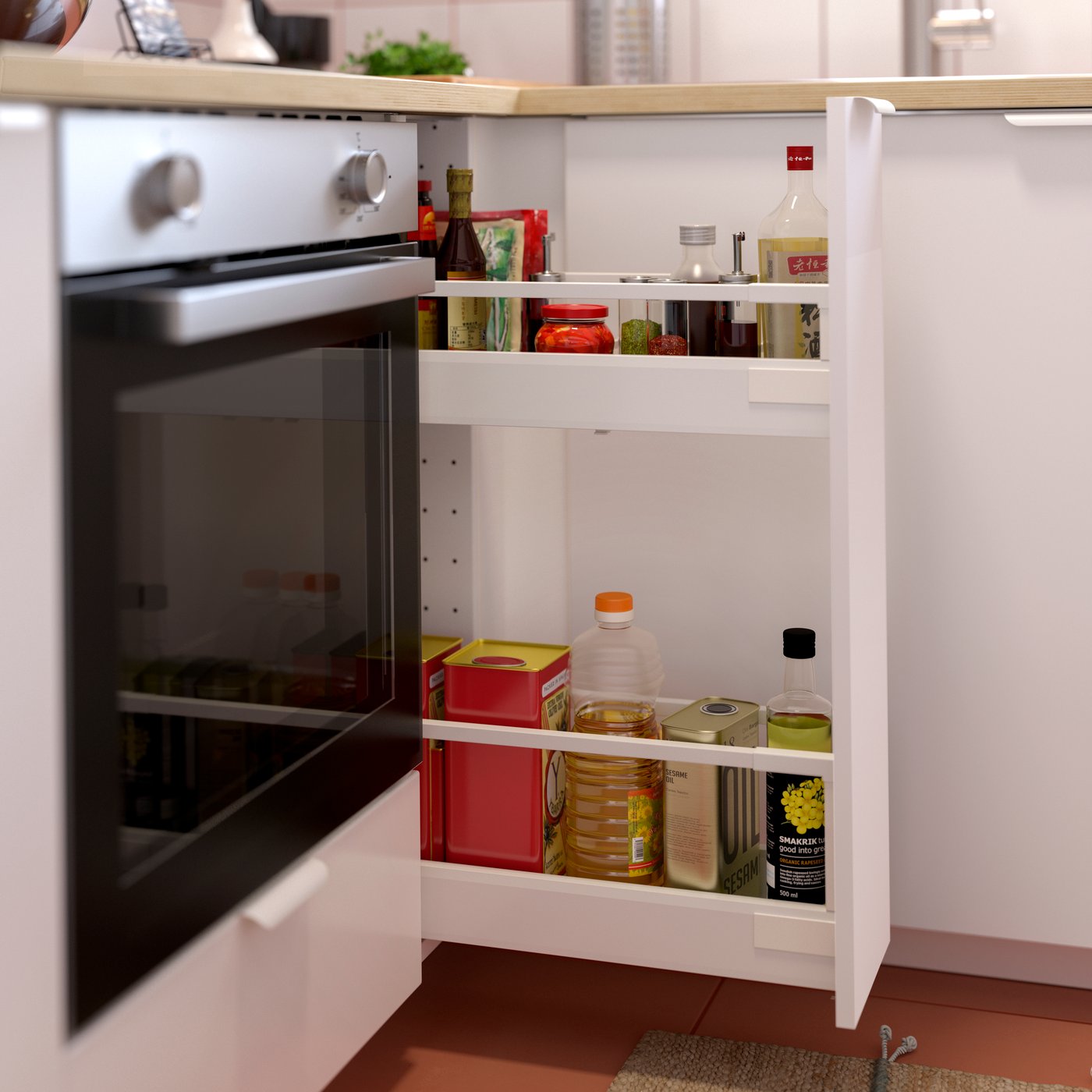 A kitchen with LAGAN oven in stainless steel by METOD/MAXIMERA pullout storage in white containing diverse bottles and cans.